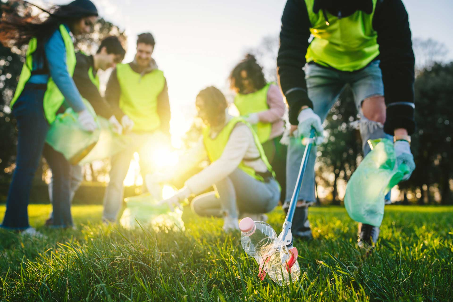 Volunteering and collecting trash.